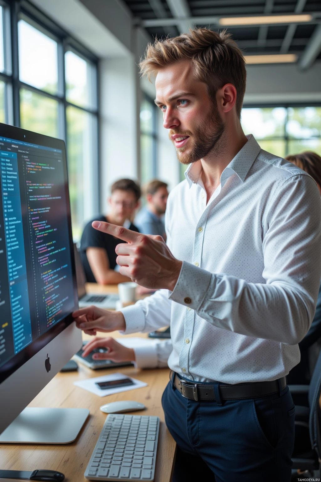 Realistic high quality photo. A 32‑year‑old man with short blonde hair, sharp blue eyes, crisp white patterned shirt and tailored dark trousers stands in a modern office, pointing at a large monitor full of complex code and a prototype button with multi‑layered micro‑interactions, a team laughing beside him while sunlight filters through the window, his expression a mix of playful grin and focused impatience.